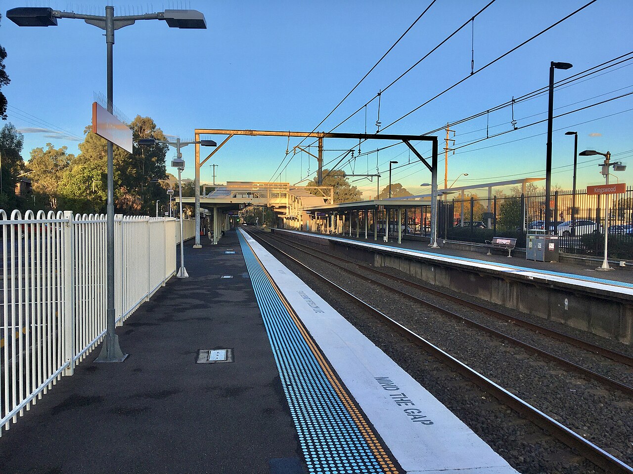 Kingswood railway station platforms at sunset, looking towards Werrington