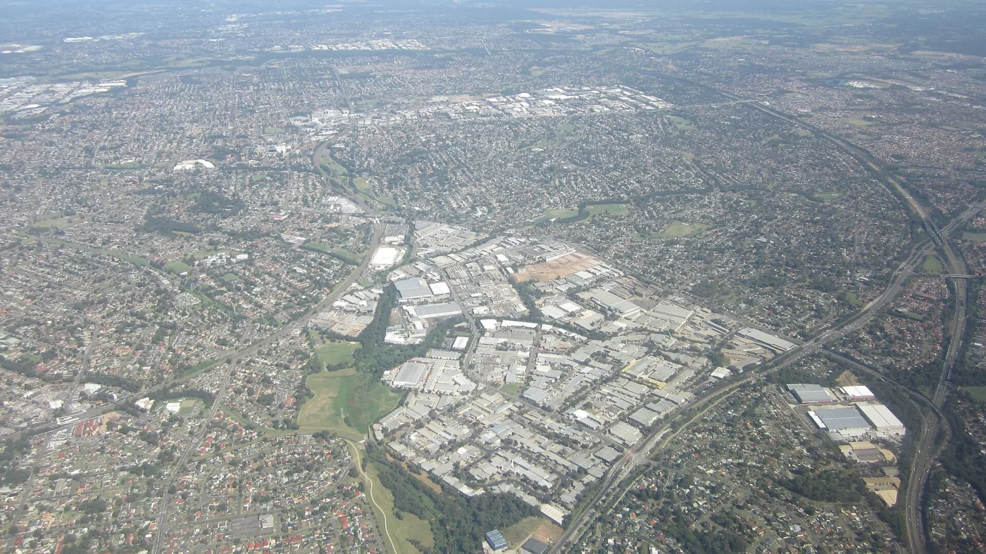 Aerial view of Blacktown and surrounding suburbs, with housing, roads and green spaces